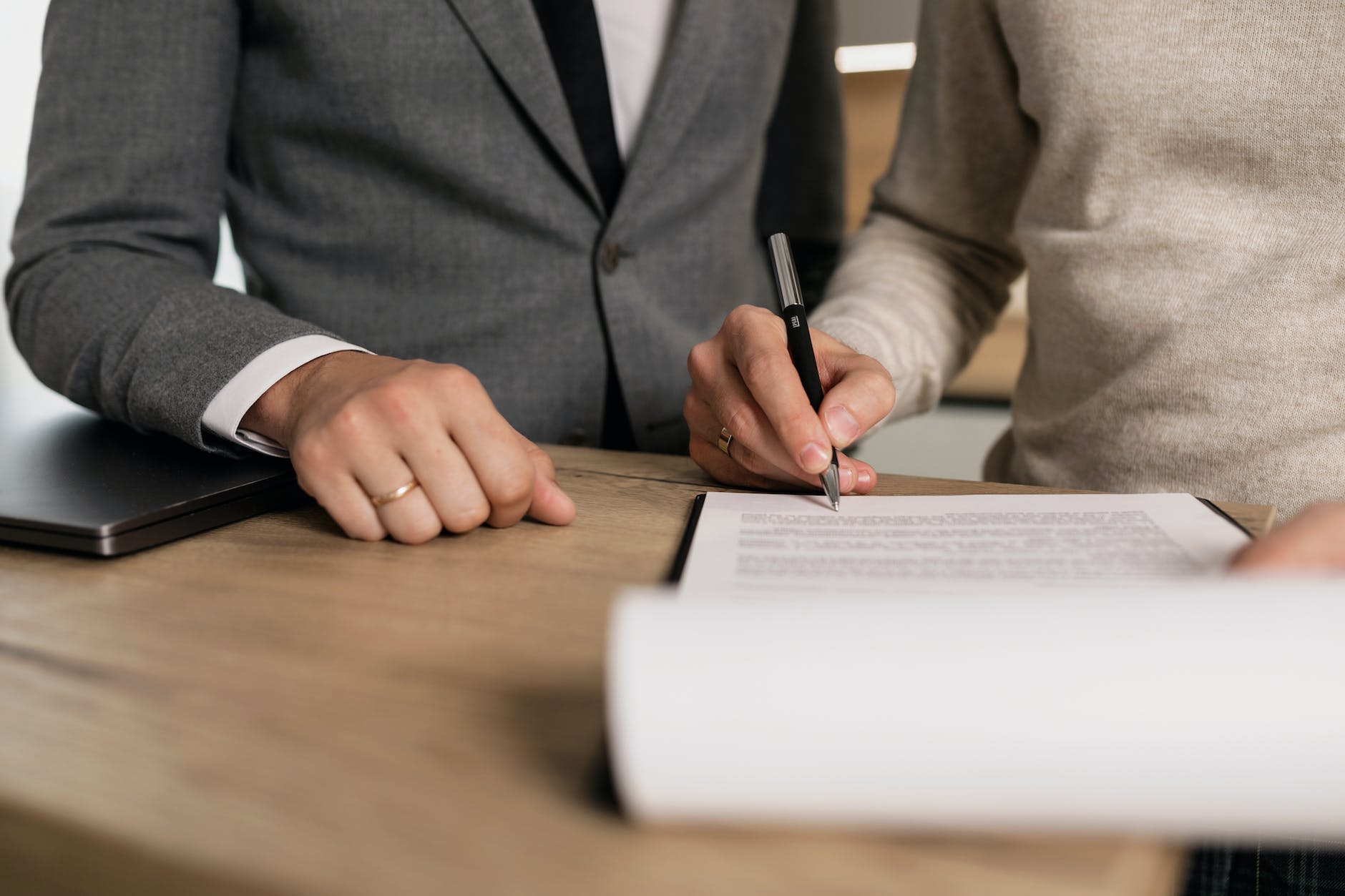 a person signing a contract-home loan